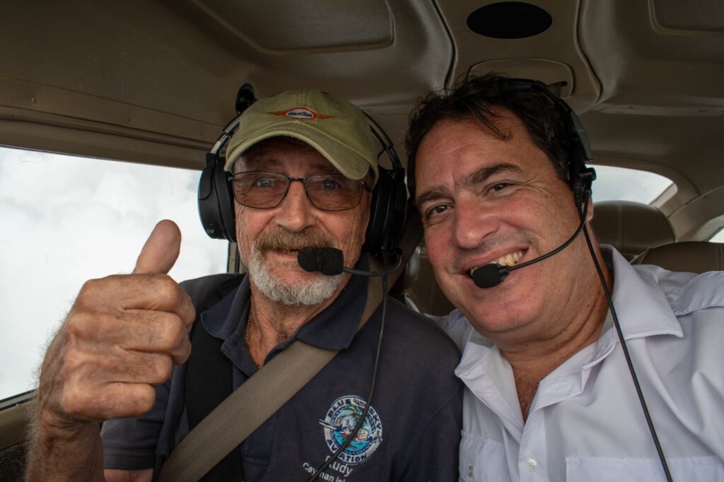 Dr Rado piloting an airplane with relief supplies to Jamaica